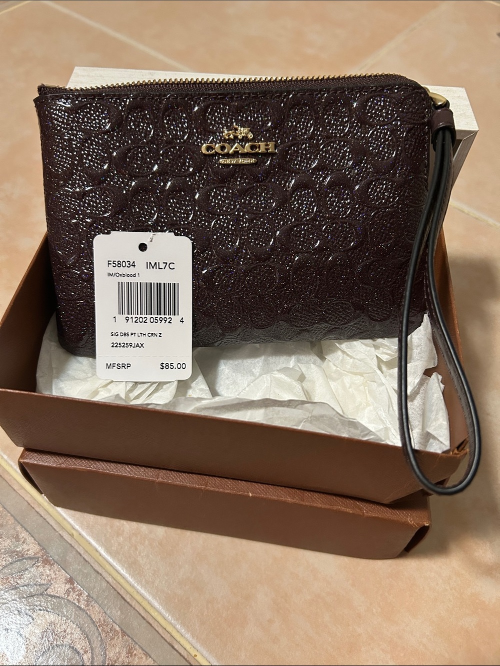 Coach Glitter Embossed Signature Wristlet in Dark Brown